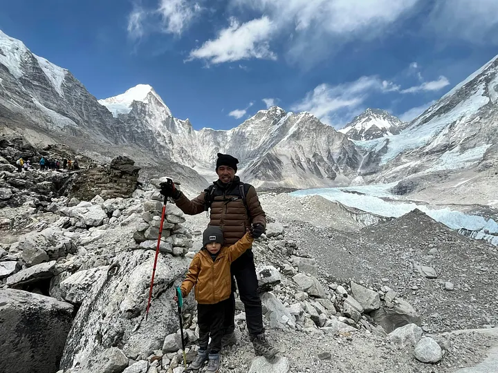 A small boy makes it to Everest Base Camp with his father.